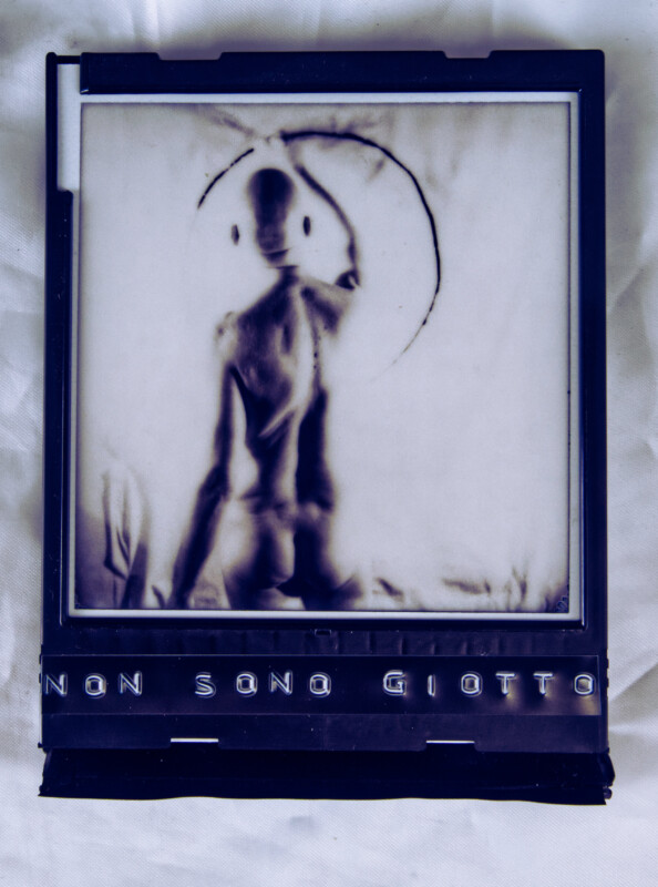 Non Sono Giotto | Object, 2025; Reproduction of an instant photo in an instant photo cartridge, embossing tape, 11×9×1.5 cm